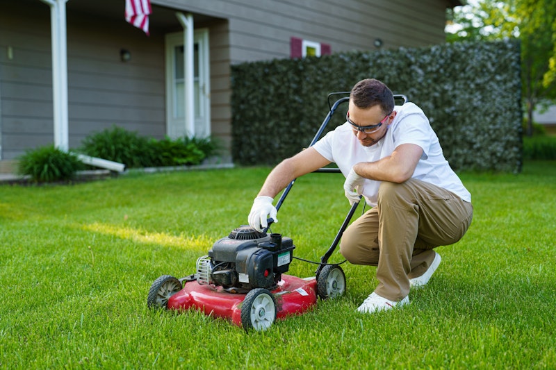 Inspecting Lawn Mower